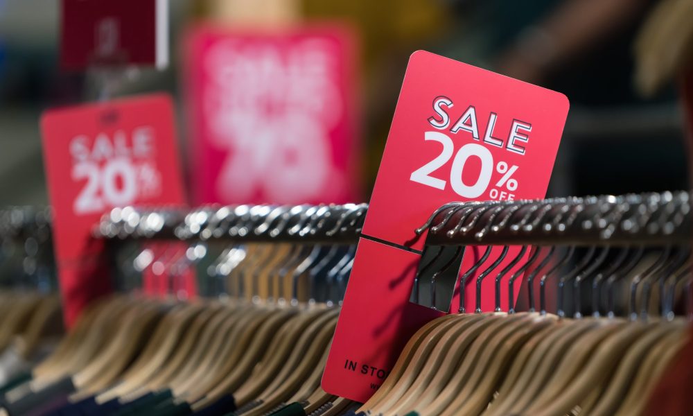 20% sale off red and white sign. Discount sale banner at cloth bar store.